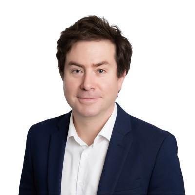 Nicholas Roberts wearing a navy blue jacket