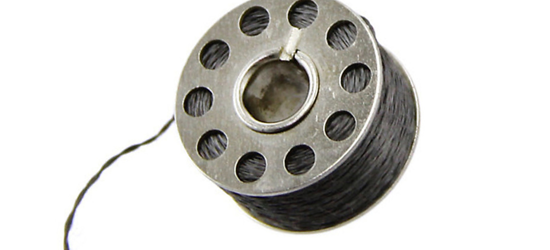 Metal bobbin wound with steel thread