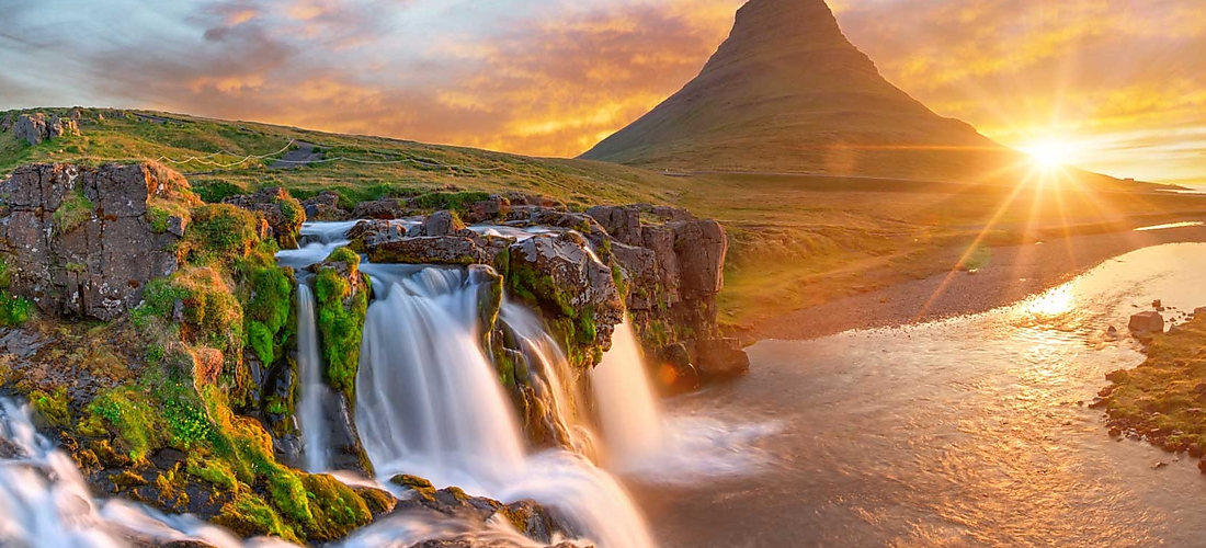 Waterfalls and a mountain in Iceland at sunset